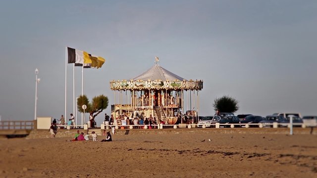 Beach carousel in France, wide shot - 1080p. A shot of a carousel on nice summer's day at the beach of Arcachon (France).