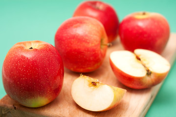 Red apples on cut board
