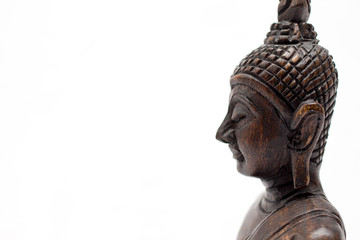 Buddha statue close up on a white background 
