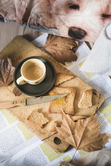 a representation of breakfast time on bed, with coffee espresso, rusks with marmelade, typical mediterranean breakfast