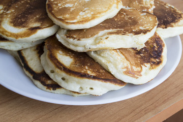 Tasty pancakes on a white plate
