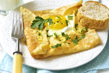 Baked pancake with egg,ham and cheese.