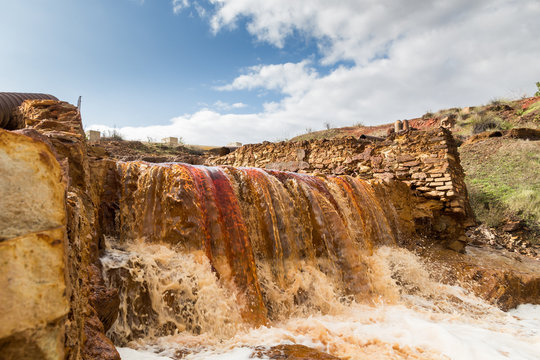 Waterfall in Riotinto mining area, Andalusia, Spain. The Riotinto (red river) is a river in southwestern Spain.