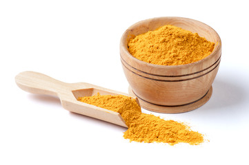 Ground turmeric isolated on white