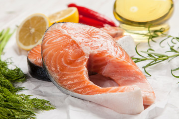 Fresh salmon on white wood