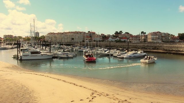 Boats docking in harbor, France - 1080p. Boats maneuvering in the harbor of  the city of Arcachon (France) - Full HD