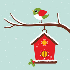 winter bird house and bird on a branch