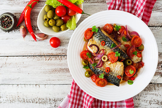 Grilled mackerel with vegetables in Mediterranean style. Top view