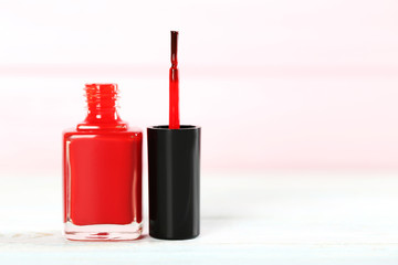 Bottle of nail polish on a wooden table