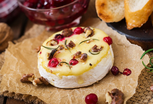 Baked cheese Camembert with cranberries and nuts