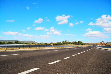 country road under a blue sky © Gabriele Maltinti