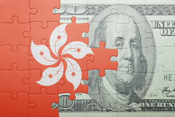 puzzle with the national flag of hong kong and dollar banknote