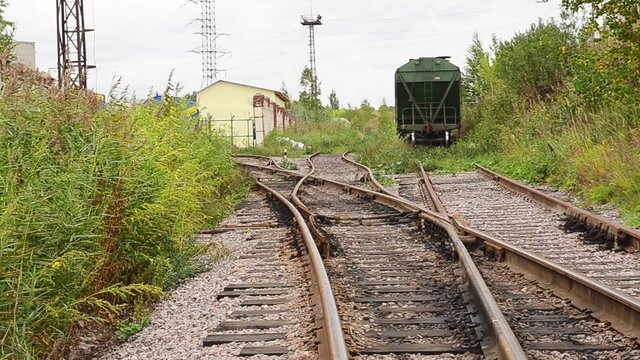 View of abandoned old railways in summer windy day
