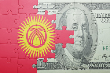 puzzle with the national flag of kyrgyzstan and dollar banknote