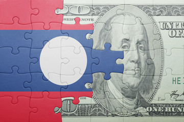 puzzle with the national flag of laos and dollar banknote