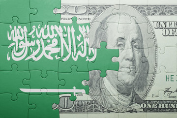 puzzle with the national flag of saudi arabia and dollar banknote
