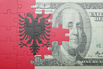 puzzle with the national flag of albania and dollar banknote