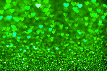 Green heart bokeh background. Valentines day texture.