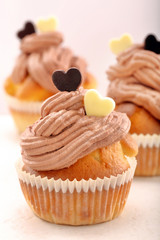 Valentine muffin with two hearts on white background