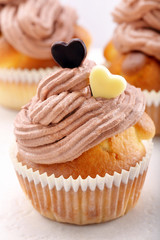 Valentine muffin with two hearts on white background