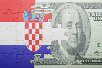 puzzle with the national flag of croatia and dollar banknote