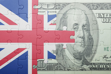 puzzle with the national flag of great britain and dollar banknote
