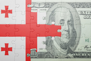 puzzle with the national flag of georgia and dollar banknote