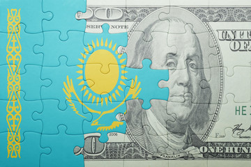 puzzle with the national flag of kazakhstan and dollar banknote