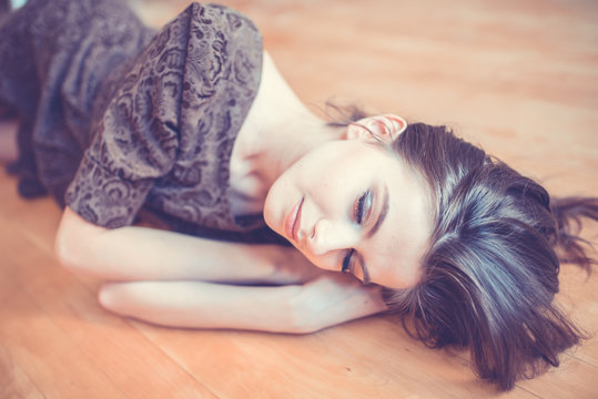 seductive woman lying on the floor