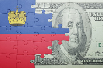 puzzle with the national flag of liechtenstein and dollar banknote