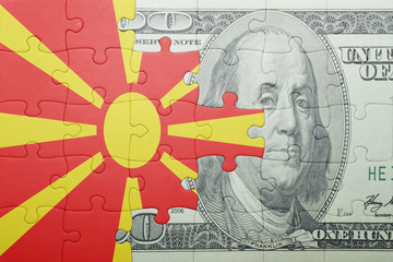 puzzle with the national flag of macedonia and dollar banknote