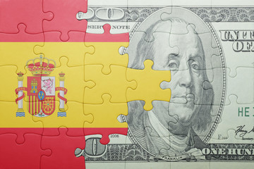 puzzle with the national flag of spain and dollar banknote