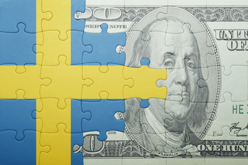 Fototapeta na wymiar puzzle with the national flag of sweden and dollar banknote