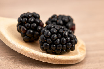 blackberries on a wooden spoon