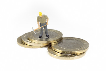 Single Worker Standing On Top Op Turkish Coins Isolated On White Background