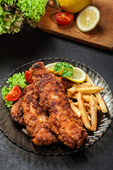 Fried fish in crispy batter with chips