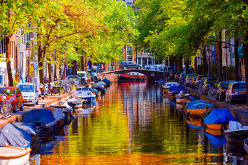 Beautiful canal in the old city of Amsterdam, Netherlands, North Holland province.