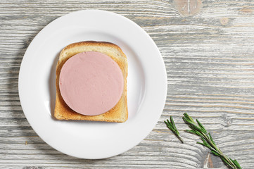 Sandwich with toasted bread and sausage