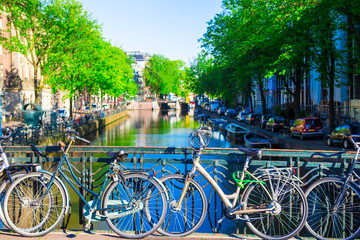 Fototapeta na wymiar Colorful bikes on the bridge in Amsterdam, Netherlands