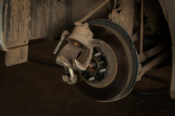 Fototapeta premium Repair Brake, Brake disk and caliper assembly on a modern car about to be replaced.