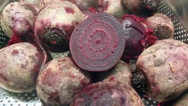 Zoom in on a purple beetroot half, at a restaurant kitchen