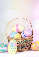 Easter Eggs and Basket on a Colorful Background