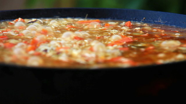 Close-up footage of a boiling plov (pilaf) - a traditional middle-East dish