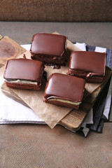 Delicious chocolate brownies on wooden background