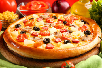 Delicious pizza with vegetables and meat, close-up