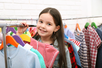 Little girl trying on a new dress