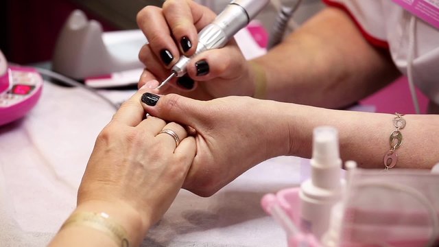 Manicure in spa salon, nails art painting