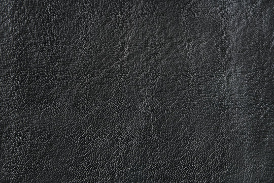 Black leather texture with uneven surface