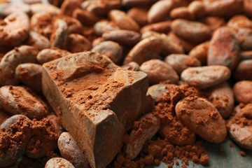 Aromatic cocoa beans and chocolate  background