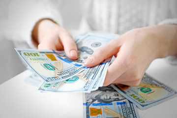 Hands counting money, close up